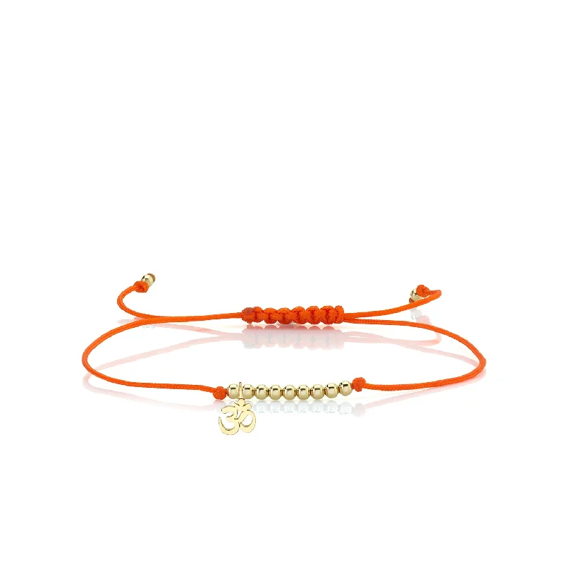 Pure Gold Tiny OM Sign Cord Bracelet